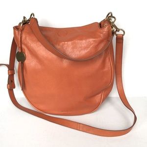 Margo brown leather hand bag & includes a shoulder strap. It’s like new!